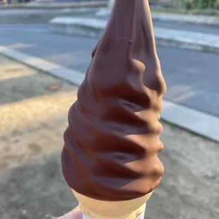 Soft serve on a regular cone with the signature chocolate dip.