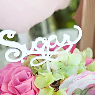 a pink and green flower arrangement