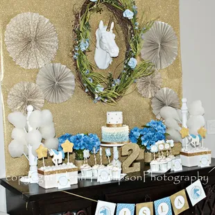 a table with a cake and decorations