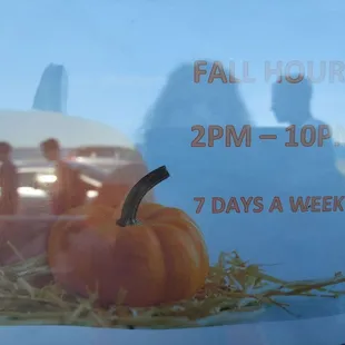 a pumpkin in a glass jar