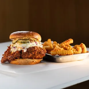 TWIST HOT CHICKEN 
fried chicken in your choice of heat level, creamy coleslaw, twist sauce, dill pickles