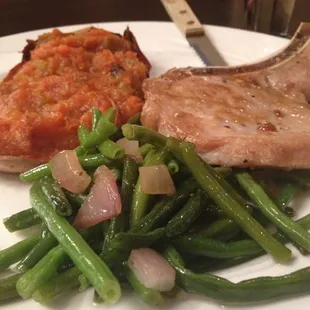 Pork chop, green beans and a stuffed sweet potato