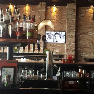 a bar with liquor bottles on the shelves