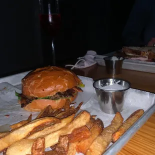 Tasty Burger with Bacon, fries, and a Pomegranate Bellini
