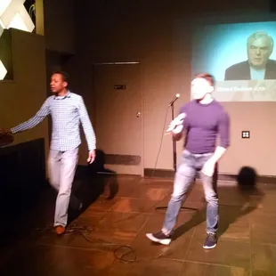 two men dancing on stage