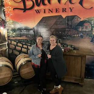 two women holding wine glasses