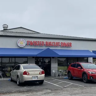 cars parked in front of the restaurant