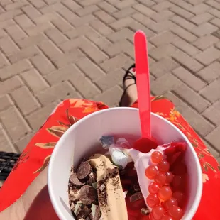 a person holding a bowl of ice cream