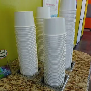 a stack of cups on a counter