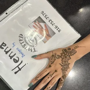 Henna designs done by TwistedeyebrowThreading team