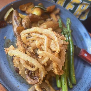 Tenderloin Filet $38.00/8oz 8oz Tenderloin steak  served with asparagus and fingerling potatoes, and topped w/ haystack onion