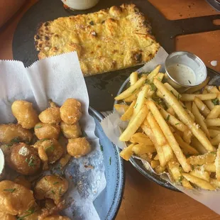 Twisted Breadsticks (V) - $7. Truffle Fries (V) - $8. Clock Shadow Beer-Battered Cheese Curds (V) - $15