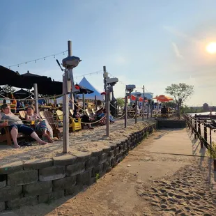 a group of people relaxing on the beach