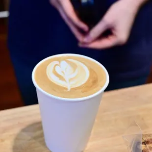 a cup of coffee with a latte art