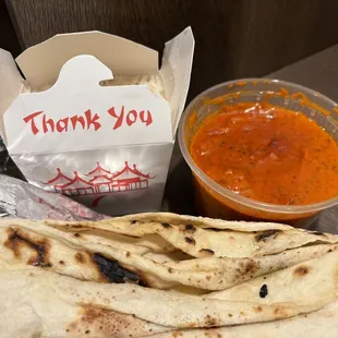 Butter chicken, rice, and Naan Bread