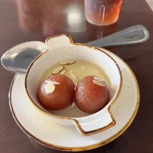 Delicious milk balls soaking in sweet syrup
