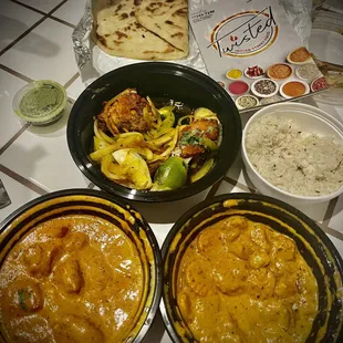Tandoori Chicken, Lamb Tikka Masala (includes rice), Veggie Korma (includes rice), and Plain Naan ...to go.