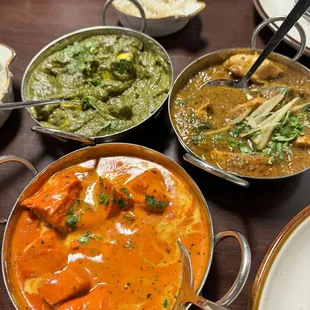 Saag paneer, chicken curry and chicken tikka masala. Photo taken after some of the food was dished up. So good!