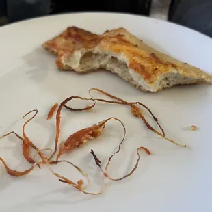 Some one forgot to take the plastic wrap off the pepperoni. This is from just one slice of our pizza. It was full of plastic.