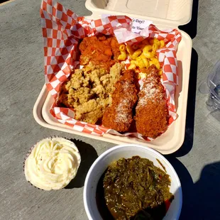 a tray of food and a bowl of dips
