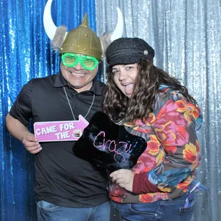 Magic Mirror Photo Booth in action, guests using our photo booth props and custom backdrop. Birthday Party!