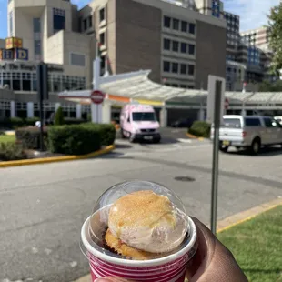 Strawberry crème brûlée cupcake and the pink cakemobile parked outside of CHKD.