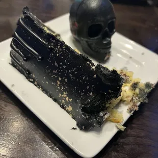Slice of cake and chocolate skull