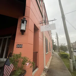 a red building with a sign that reads 300
