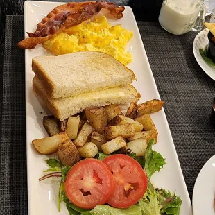 a plate of food with a sandwich and fries