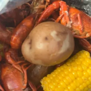 Traditional crawfish, corns, potatoes and Cajun sausage