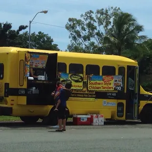 a yellow school bus parked in a parking lot