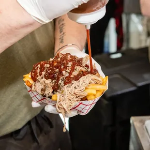 a person holding a plate of food