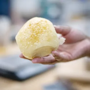 a person holding a doughnut