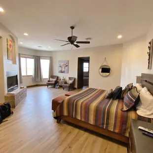 a hotel room with a bed and a television