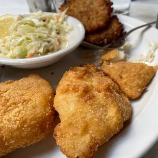 Fish fry Friday Cod with potato pancakes and cole slaw.  Sides tarter sauce and apple sauce.  Yum!