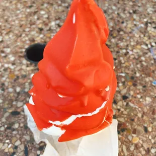 a red and white hat on a white napkin