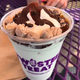 a dessert in a plastic cup