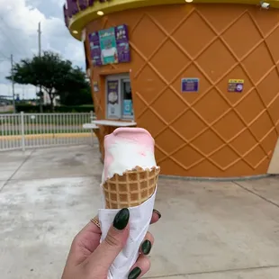 Strawberry and vanilla ice cream in a waffle cone. So delicious!!