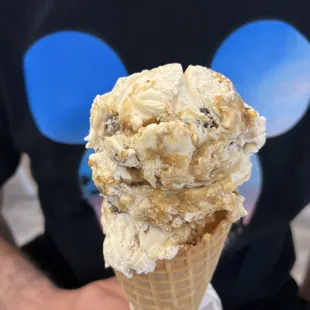 a man holding a cone of ice cream