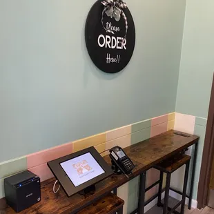 a desk with a phone and printer