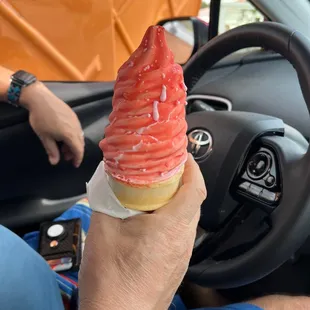 Cherry dipped strawberry ice cream cone