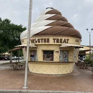 a large ice cream cone on the corner