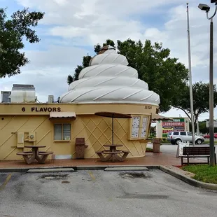 an ice cream shop in a parking lot