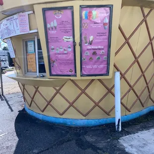 an ice cream shop on a street corner