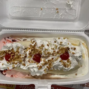 Banana split with strawberry chocolate and vanilla ice cream