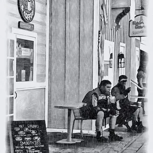 two boys sitting on a bench
