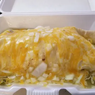 a burrito in a styrofoam container