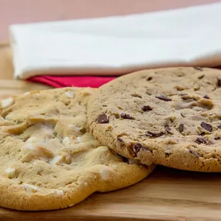 two cookies on a cutting board