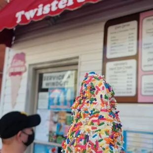 Small twist cone dipped in rainbow sprinkles