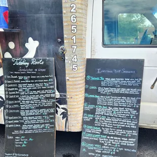 a chalkboard sign and a truck